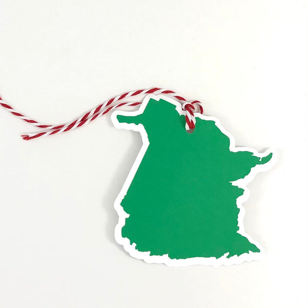 A single gift tag in the shape of the Canadian Province of New Brunswick is shown against a white background