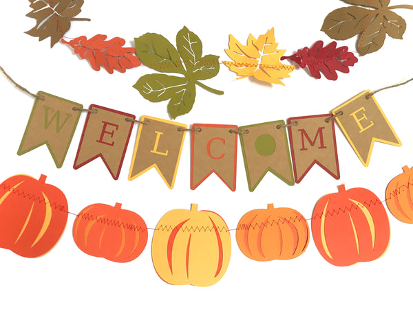 Three fall themed garland and banners are shown against a white background. The top garland is of fall leaves in fall colours, the middle banner reads Welcome in fall colours, and the bottom garland is of pumpkins