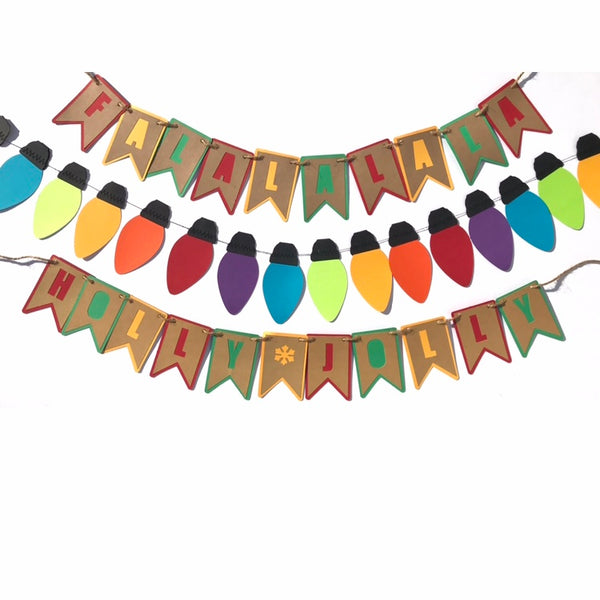 Three colour coordinated banners and garlands are hung against a white background. Top banner reads FALALALA, bottom banner reads HOLLY JOLLY  middle garland is a string of colourful paper christmas lights
