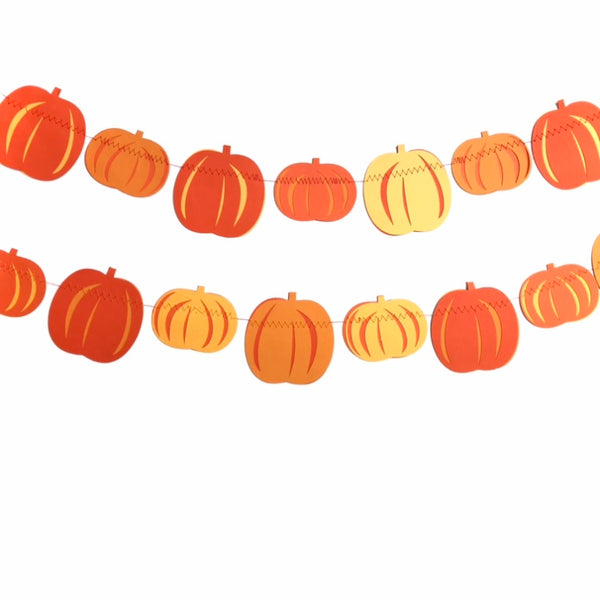 Two strings of paper pumpkin garlands are hung against a white background.  Each garland has a repeating pattern of one tall pumpkin and one short fat pumpkin in various orange colours
